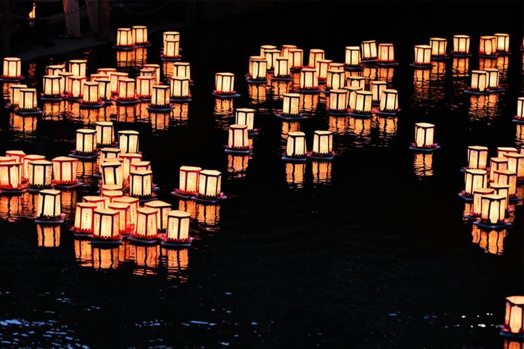 Flow into the river a lantern memorial service for the ancestors, it is a traditional event = Shutterstock