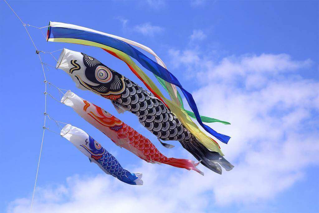 Japanese koinobori flags for Children's day on blue sky background = Adobe Stock