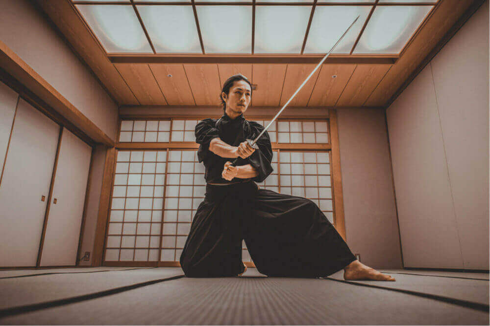 Samurai training in a traditional dojo, in Tokyo = Shutterstock