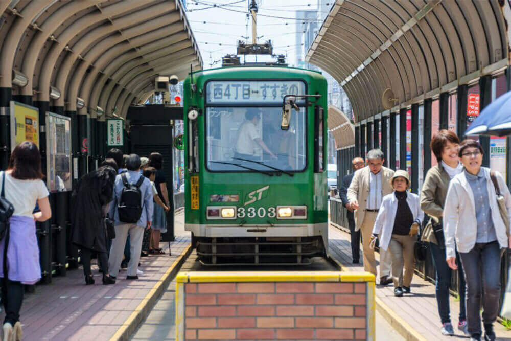 Sapporo street car at the station on June 16, 2015. Sapporo street car is a tram network since 1909, located in Sapporo, Hokkaido, Japan = Shutterstock