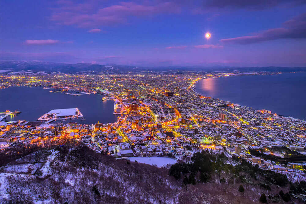 Twilight night view of Hakodate from Mount Hakodate, winter season, Hokkaido, Japan = Shutterstock