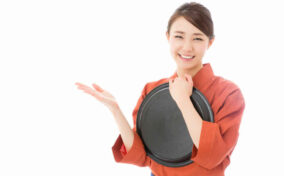 japanese style waitress showing isolated on white background = Shutterstock