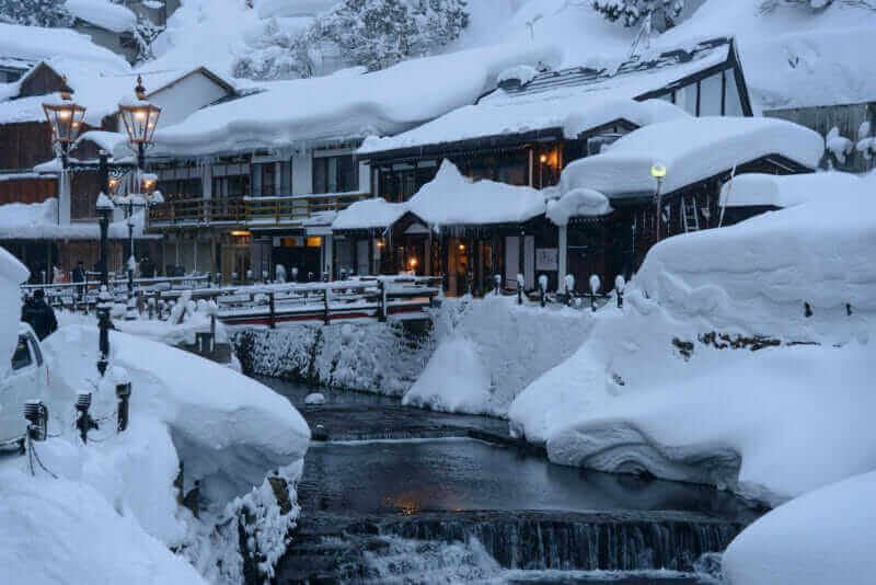 During this period, you can appreciate the real snow scene. The photo shows Ginzan Onsen in Yamagata Prefecture = AdobeStock