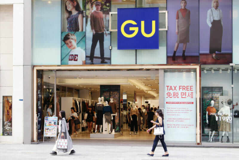 View of the frot of a large GU clothes store in Ginza in central Tokyo. GU is owned by Fast Retailing which also owns Uniqlo = shutterstock