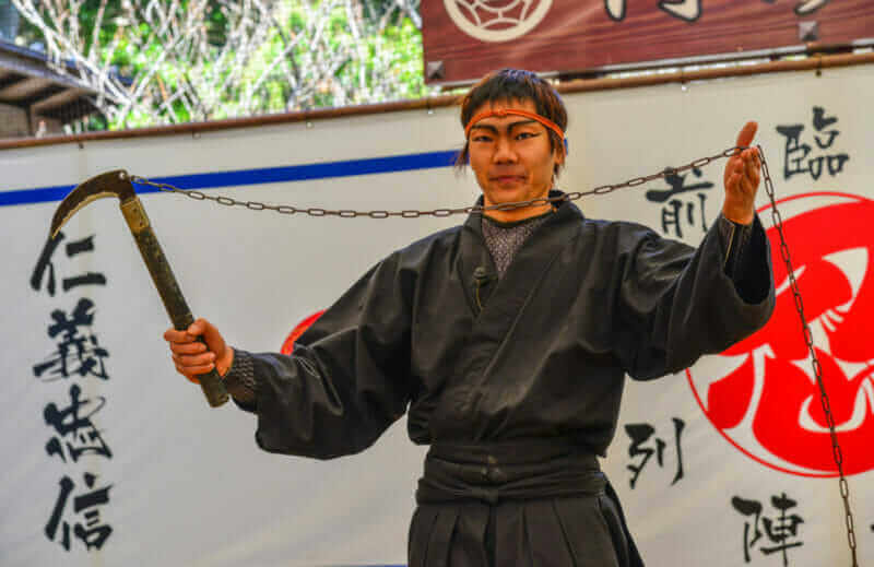 A man wearing Ninja costume and teaching at the Ninja School in Iga City, Japan