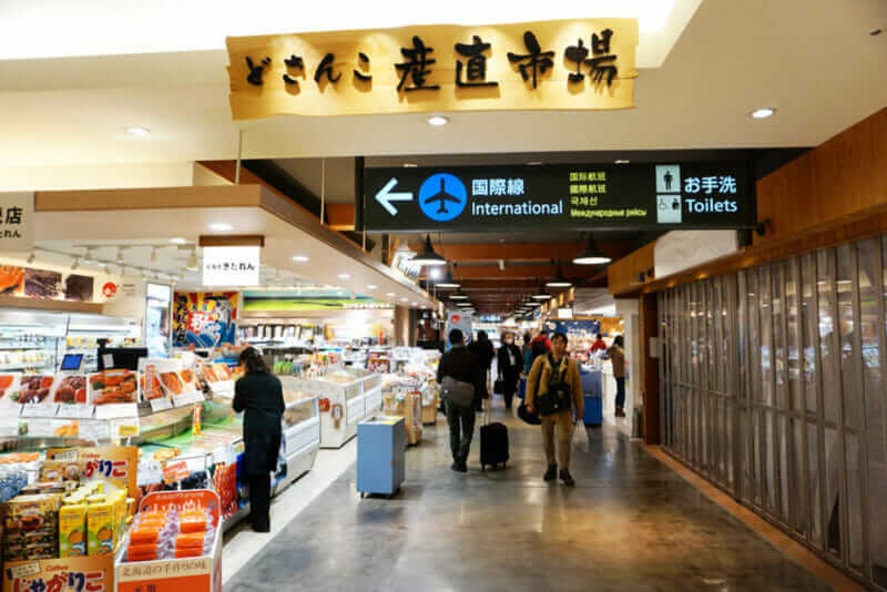 Fresh Japanese seafood store inside airport sale various raw fresh seafood on sale at New Chitose International Airport, Japan = shutterstock