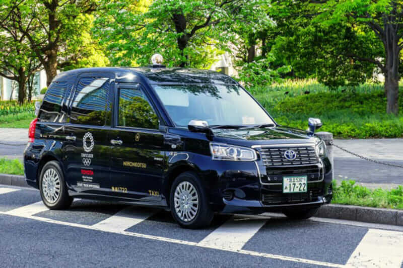 New model of Japanese Taxi called JPN Taxi prepares for Olympic 2020 tourism boom with accessible cabs and international drivers = shutterstock