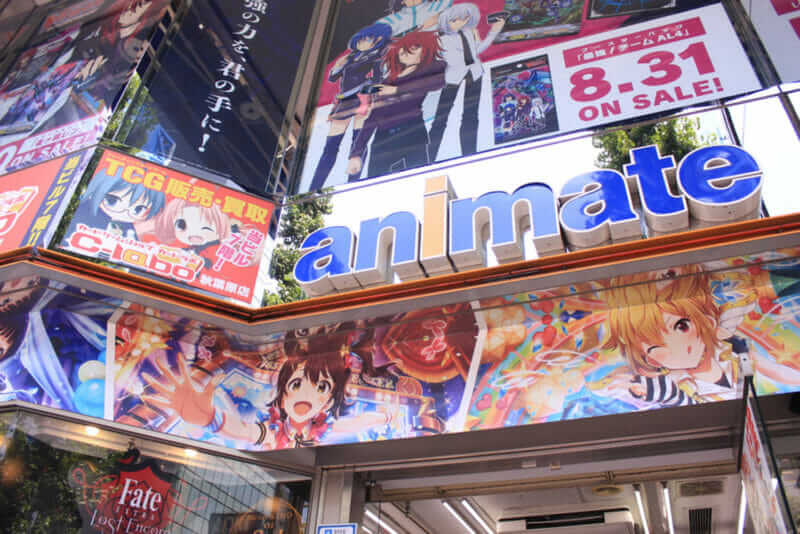 Animate storefront covered with anime advertising posters, Akihabara, Tokyo = shutterstock