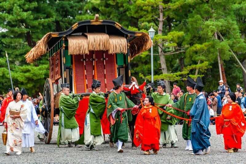 Festival of The Ages, an ancient costume parade held annually. Each participant dressed in an authentic costume of a character in different Japanese feudal periods = shutterstock