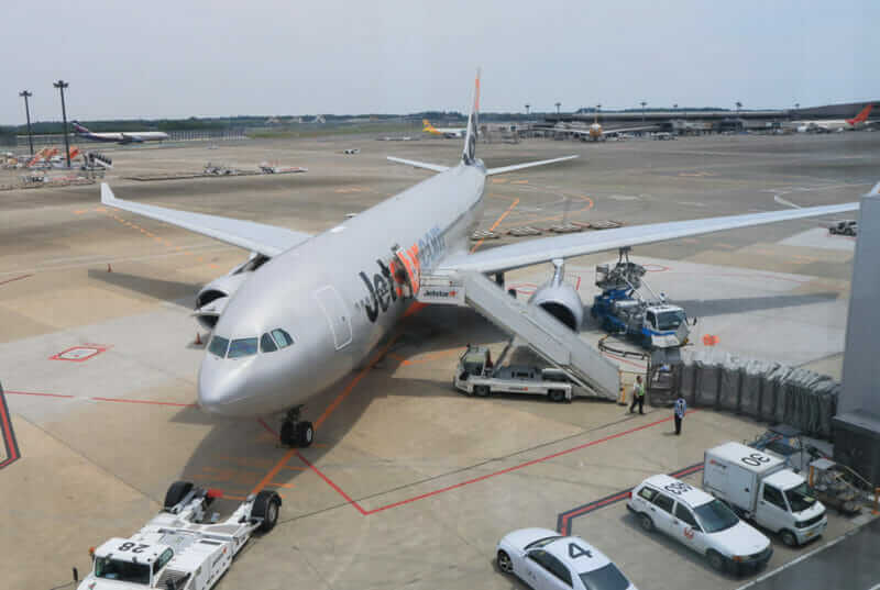 Jetstar airplane prepares for departure at Narita airport = shutterstock