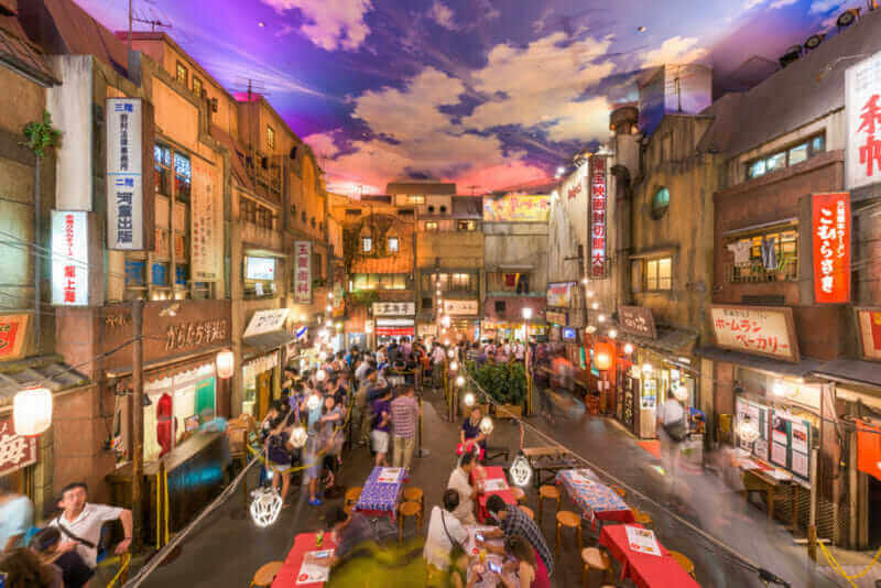 Crowds in the Shinyokohama Raumen Museum. The exhibit is a 1:1 replica of the historic Shitamachi district of Tokyo and offers regional Ramen restaurants = shutterstock