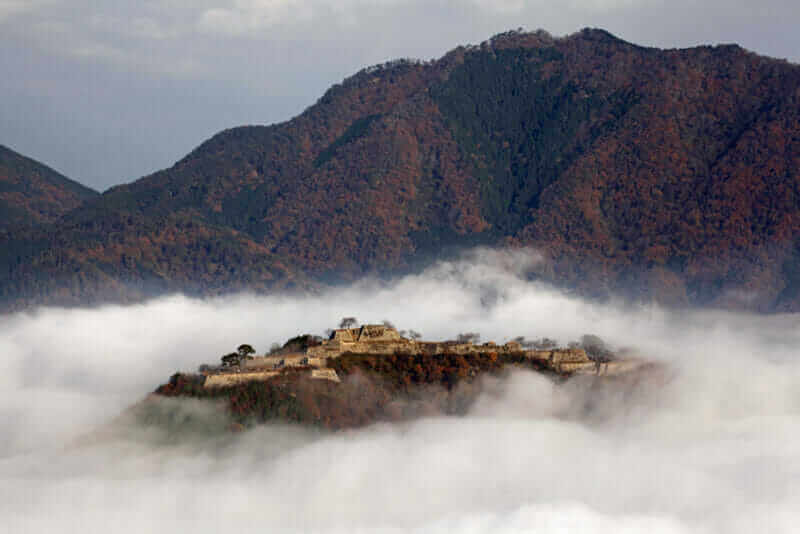 Old castle above clouds. Japan = shutterstock