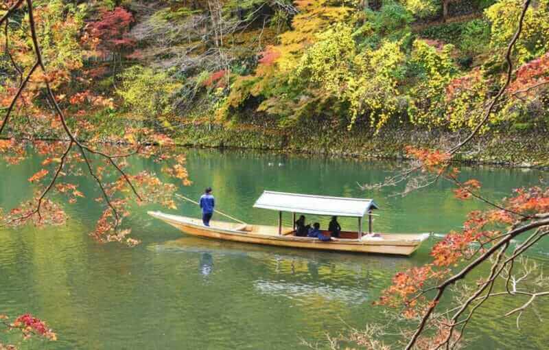 Tourist Boat in Autumn at Hozugawa River, Arashiyama, Kyoto, Japan = shutterstock_722746222