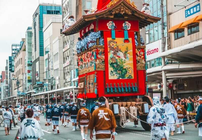 Gion Matsuri Floats are wheeled through the city in Japans most famous festival = shutterstock