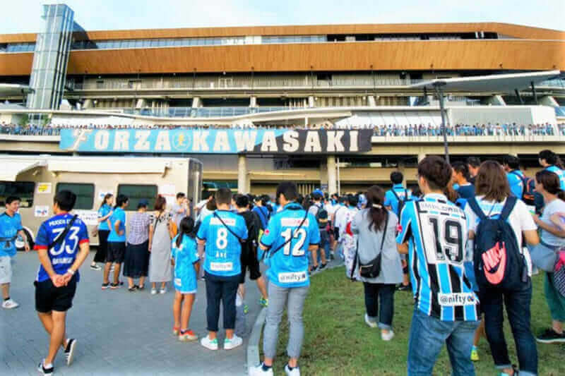 At Todoroki Athletics Stadium, Japan The atmosphere before a J-League Football match. Kanagawa Derby match between Kawasaki Frontale vs Yokohama F. Marinos = shutterstock