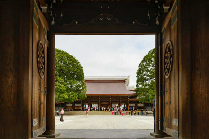 Wooden gates view entrance to Meiji Shrine in Shibuya, Tokyo, Japan = shutterstock