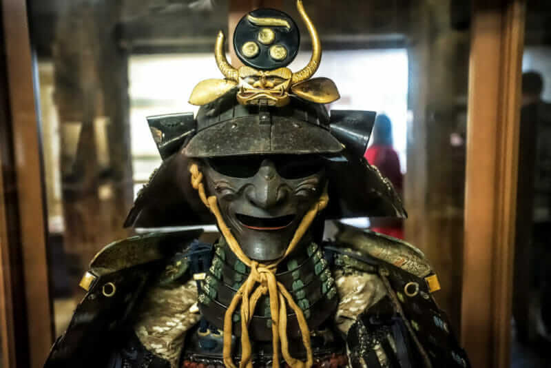 Samurai traditional war helmet and armor in the museum of Matsue castle in Matsue, Shimane prefecture, Japan = shutterstock