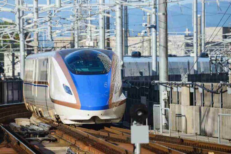 Hokuriku Shinkansen running in Kanazawa on the Japan Sea side, Ishikawa Prefecture, Japan = shutterstock