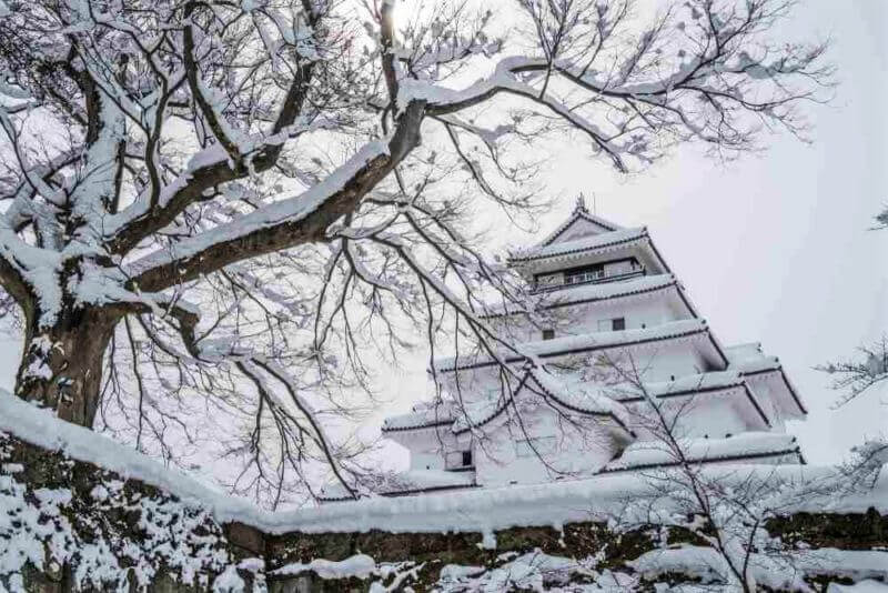 Tsuruga castle in Fukushima, Japan, Covered with snow in winter = shutterstock