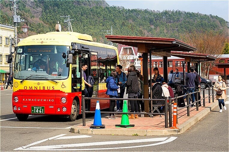 Kawaguchiko Station, Tourists are using the tour bus service. Transportation is very convenient for both train and bus = shutterstock