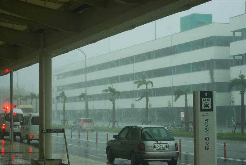 Summer Typhoon hitting Okinawa airport = shutterstock