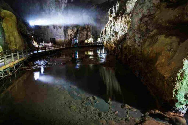 The immense Nagabuchi chamber in Akiyoshi-do, Japan's largest limestone cave, is known for its high ceiling and river floor = shutterstock
