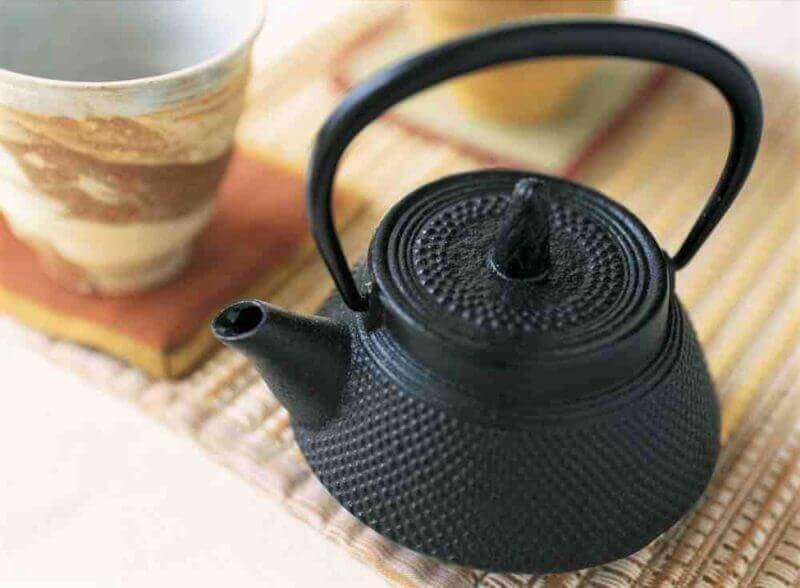 Nambu ironware and Japanese Teacup = shutterstock