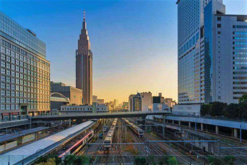 Cityscape around railway Shinjuku Station with NTT Docomo Yoyogi Building, Shinjuku is one of Tokyo's business districts. There are many skyscrapers, such as Hotels, office buildings = shutterstock