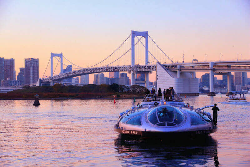 People ride Hotaluna tour cruise boat in Tokyo, Japan. Tokyo is the capital city of Japan. 37.8 million people live in its metro area = shutterstock