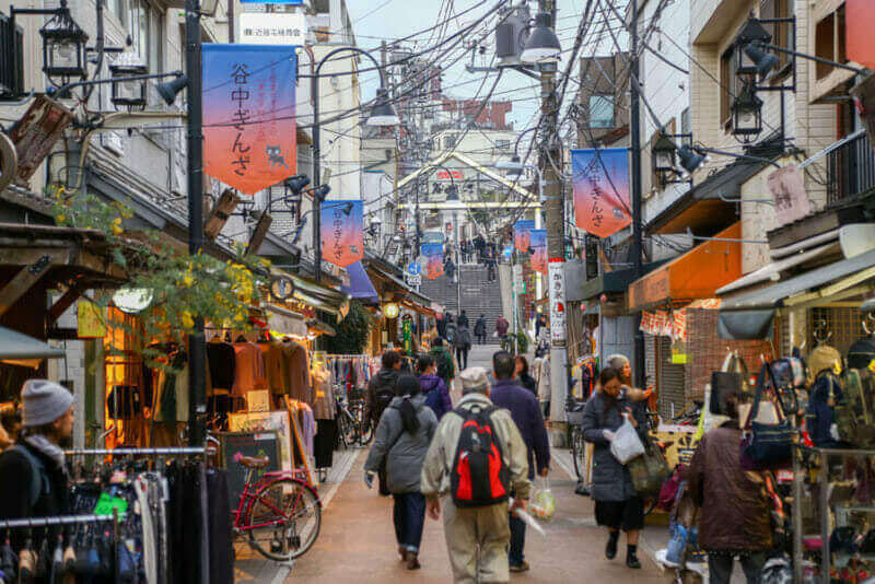 People walking at Yanesen market the ancient trading district of Japan - Evening light = shutterstock