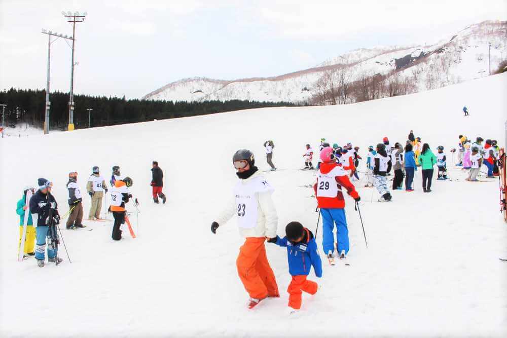 April 10,2017: A group join ski race at winter Niseko, Hokkaido = Shutterstock