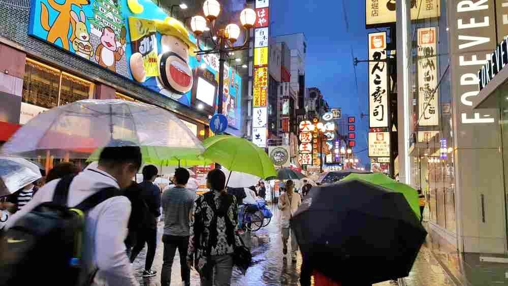 May 13, 2018: Shinsaibashi shopping area in the rainy day, Osaka, Japan = Shutterstock