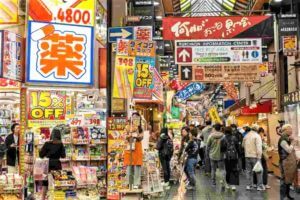 October 22, 2018: Pharmacy and beauty shop at Kuromon Ichiba. The Kuromon Ichiba is a spacious market with vendors selling street food, fresh produce and shellfish, plus souvenirs, Osaka, Japan = Shutterstock