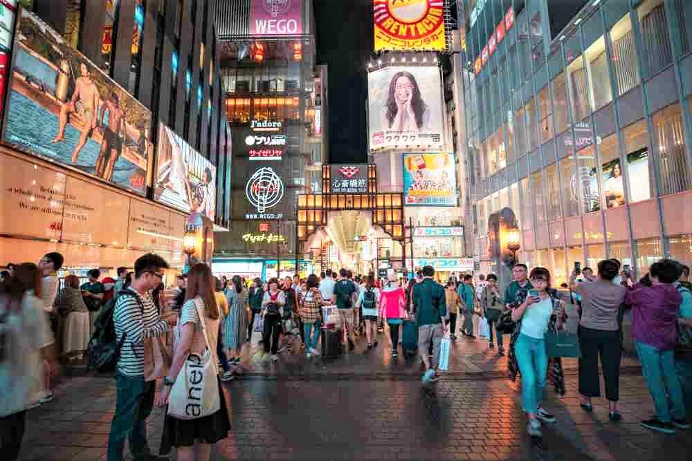 June 17, 2019 : Traveling on Dotonbori in evening, Crowded people shopping and dinner on this famous street, Osaka, Japan = Shutterstock