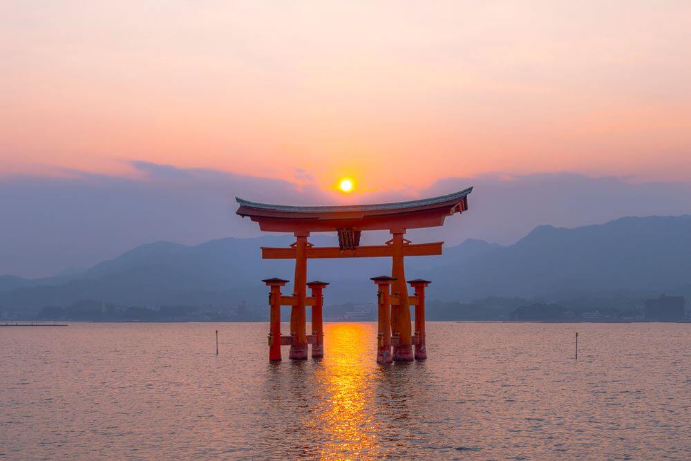 The torii gate of Itsukushima Shrine on Miyajima Island = Shutterstock