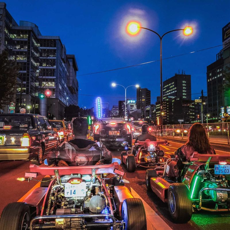 People Go-Karting as a tour in the middle of Tokyo City Center = Shutterstock