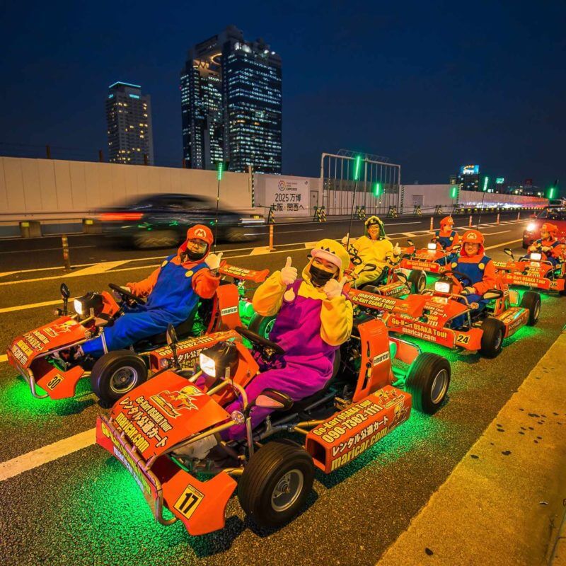Mario Kart with costumes around Osaka Station in winter night with light illumination event in downtown Osaka = Shutterstock