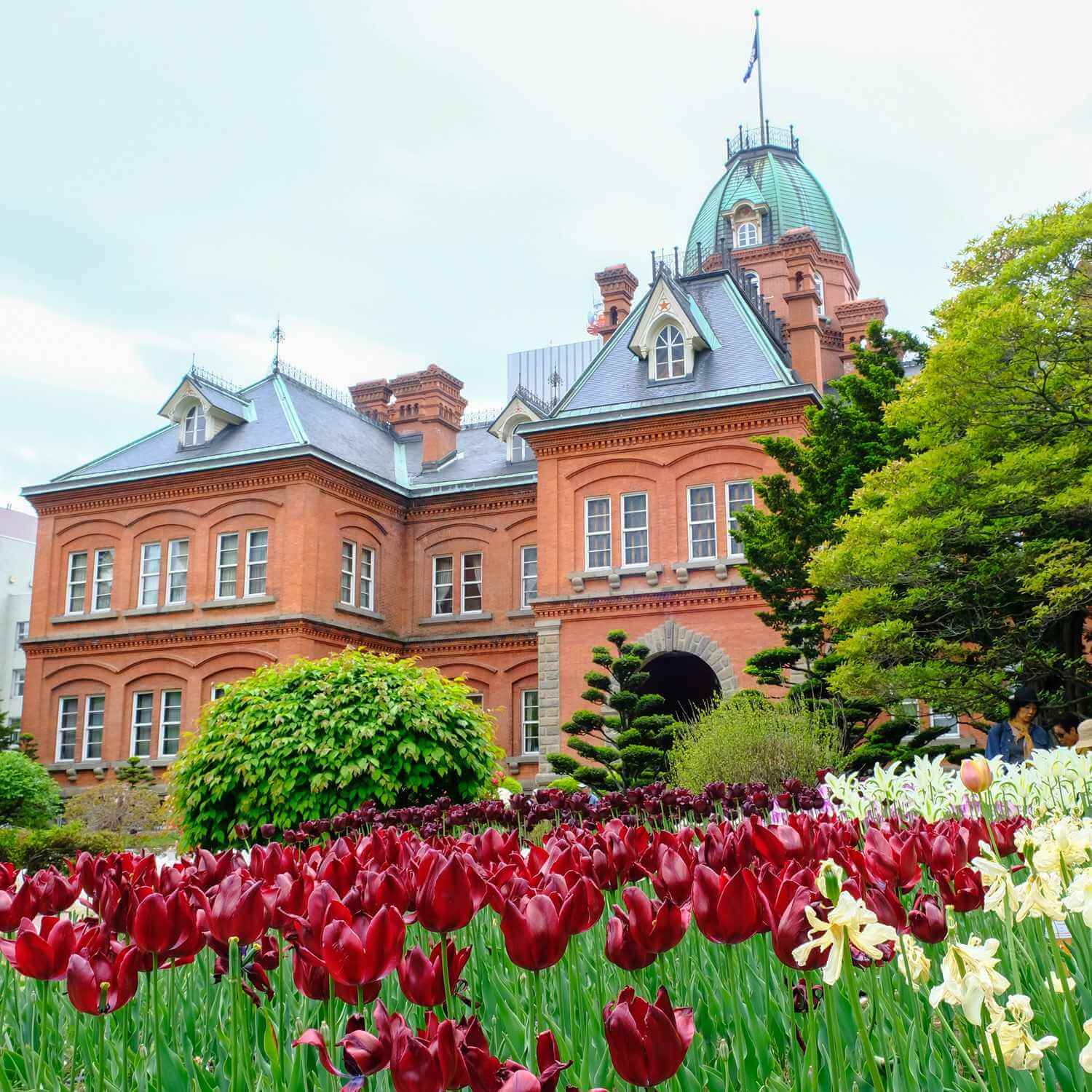 The old Hokkaido Government Office Building during spring season in Sapporo = Shutterstock
