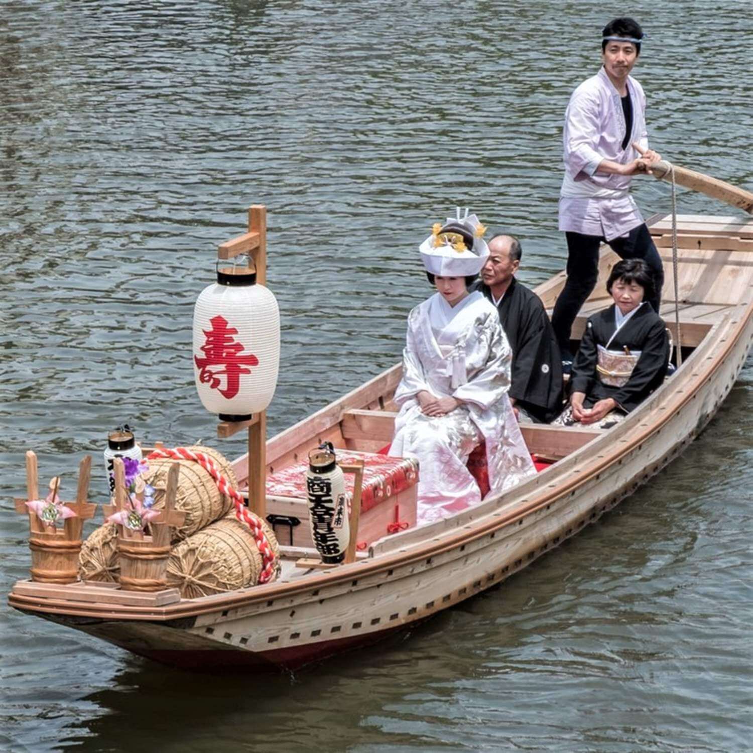 The number has fallen considerably, but in some rural areas, brides may still ride on small boats to wedding venues = Shutterstock