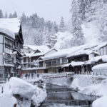 Ginzan Onsen, a retro hot spring town with a beautiful snow scene, Yamagata = AdobeStock 1