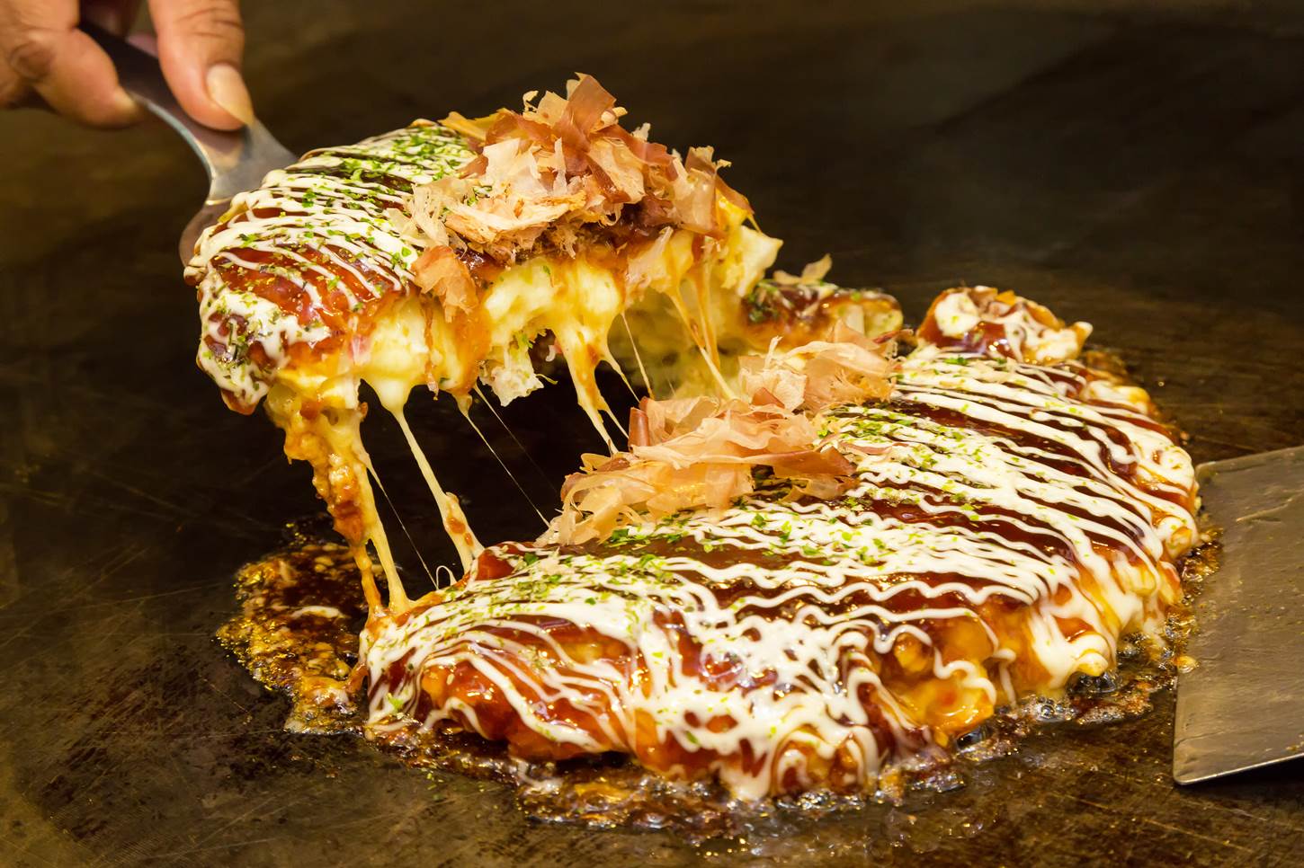 Okonomiyaki, the soul food of Japan = Shutterstock