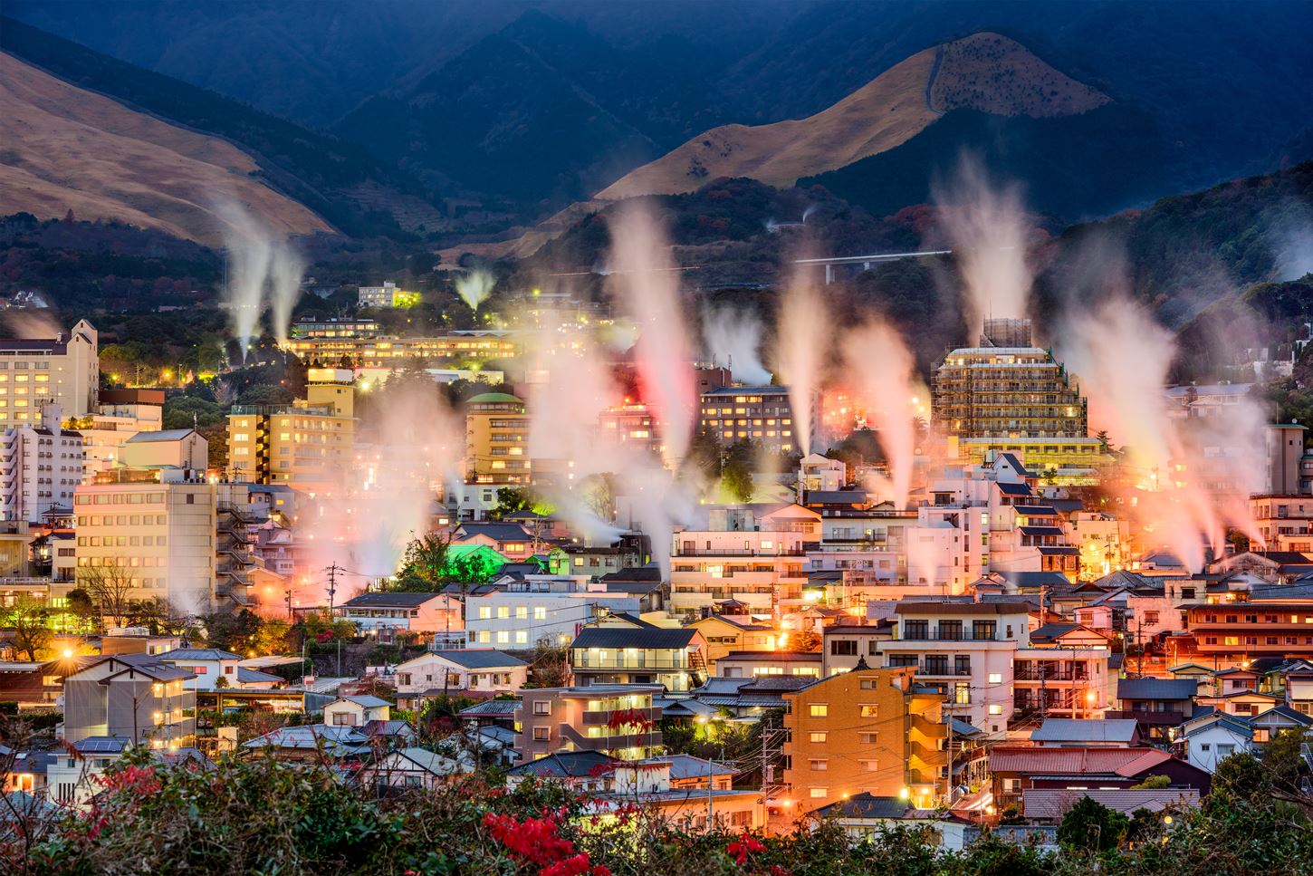 Hot spring steam rises from the entire city of Beppu, creating a fantastical world of illuminations, Beppu, Oita Prefecture, Japan = Shutterstock